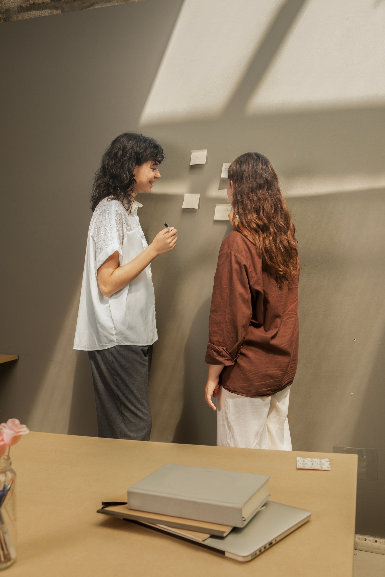 Neurodivergent Woman Discussing with a Colleague 